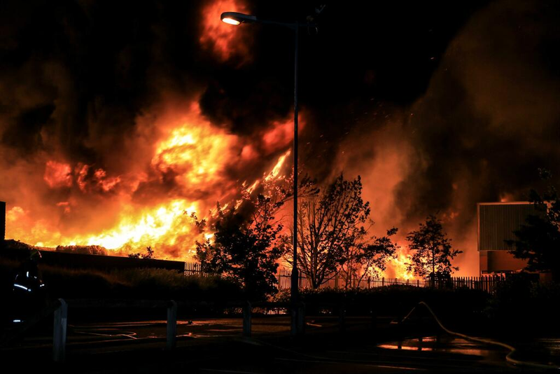 Illustration for article titled Stunning Photos: Raging Fire Fed by 55,000 Tons of Plastic and Paper